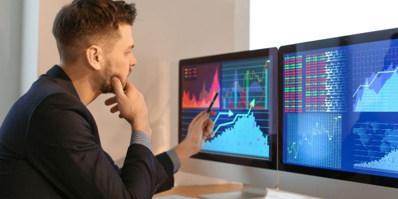 A financial analyst using financial analytics tools to analyze financial data